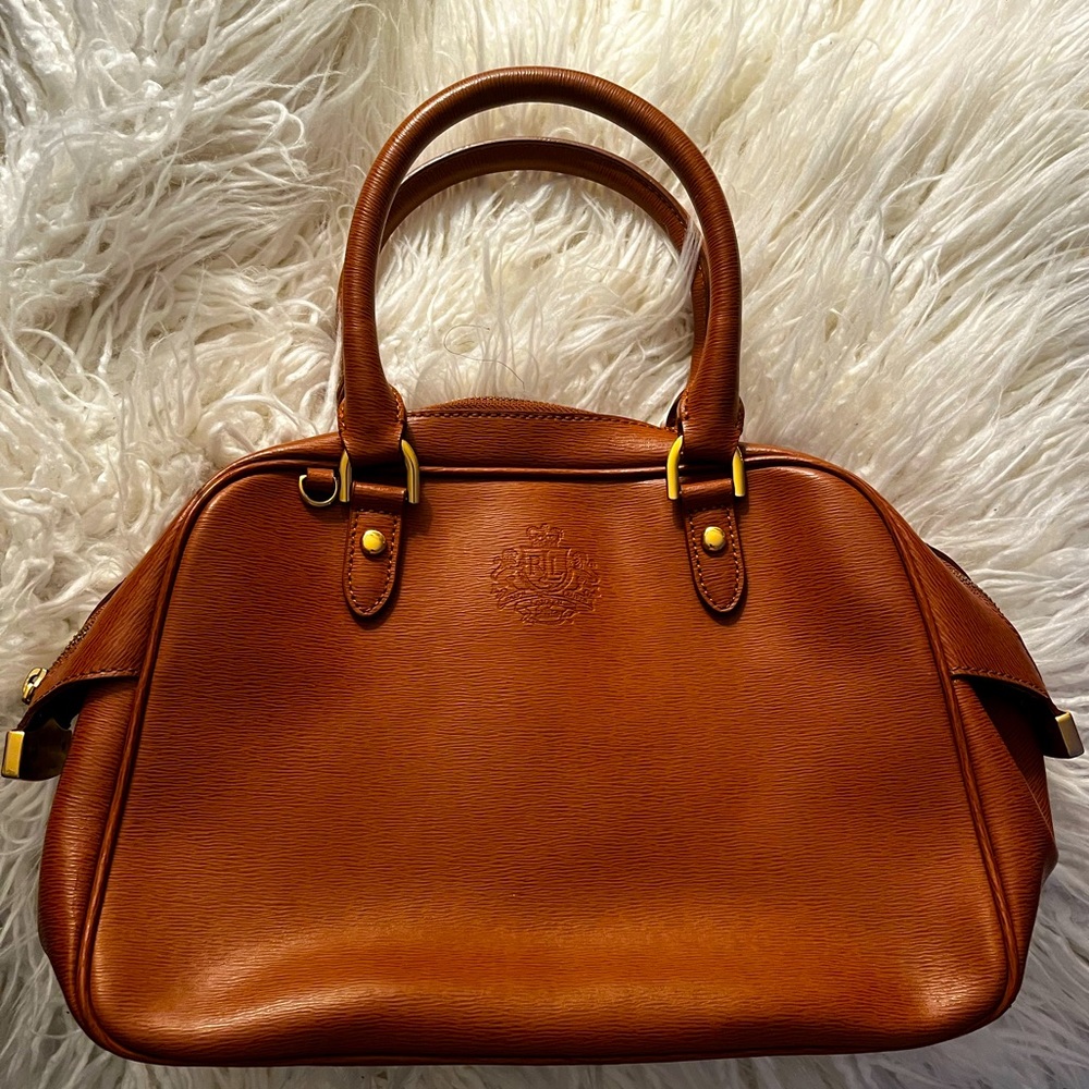 Tan genuine leather Ralph Lauren 1997 tan handbag with black interior.
